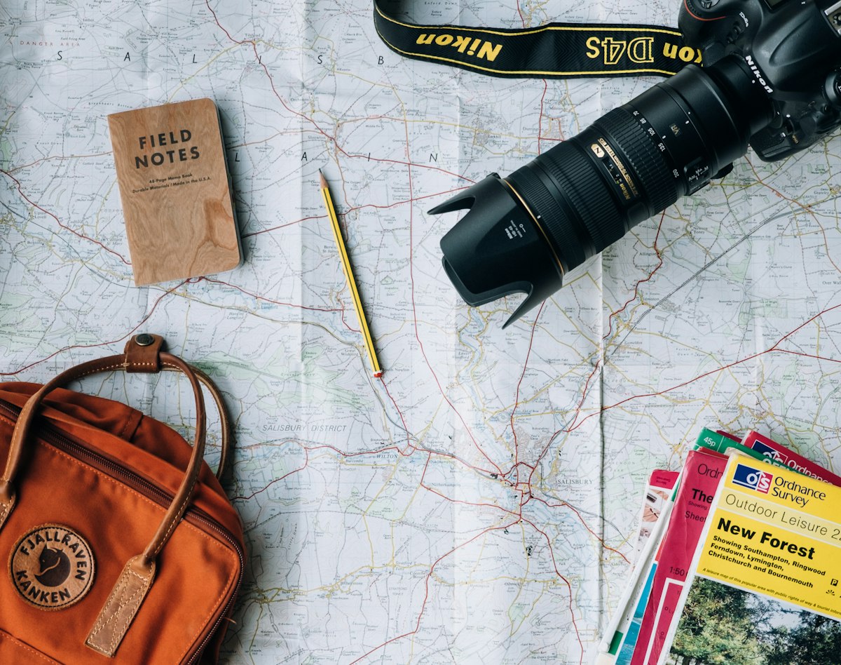 Traveller with a map planning a journey outdoors
