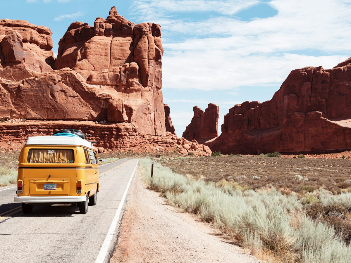 Travellers paused at a scenic overlook during a road journey